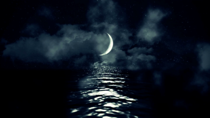 magical-crescent-moon-above-the-sea-reflecting-on-water-on-a-cloudy-starry-night_ekhi4vlog__f0000